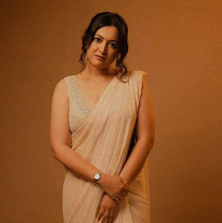 Archie in an ivory sari, studio portrait